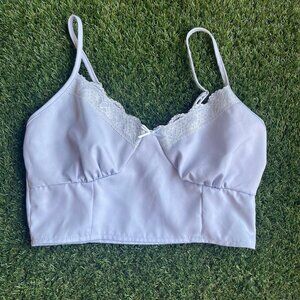 Blue lace crop top with a bow detail